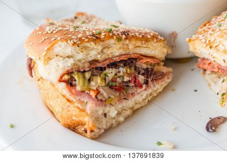 A Muffalata on Crusty Bread in plate