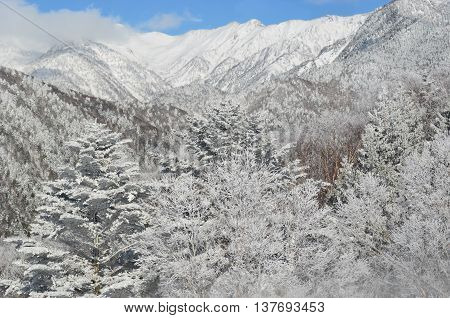 A mountain covered with white snow in Oku-Hida Japan.