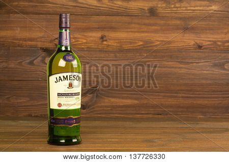 READING MOLDOVA APRIL 8, 2016. One bottle of Jameson Whiskey Triple Distilled 40% 1 Liter on black background. Blended whiskey is imported from Ireland