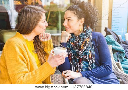 Lesbian Couple Having A Coffee At A Cafe