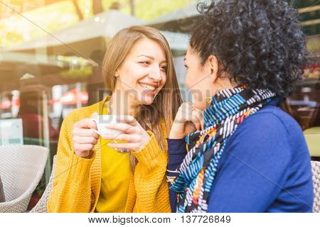 Lesbian Couple Having A Coffee At A Cafe