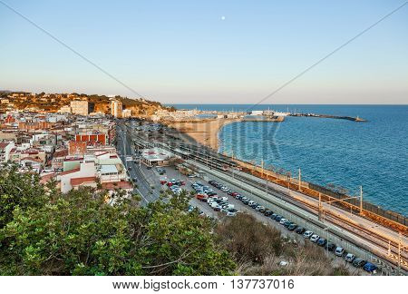 ARENYS DE MAR BARCELONA SPAIN - FEB 20 2016. View over the town the beach and the fishing harbor of Arenys de Mar on the mediterranean coast near Barcelona.
