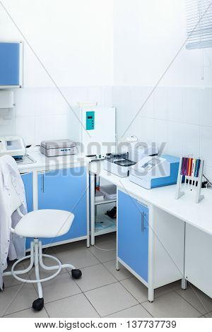 Laboratory room with medical equipment to conduct medical tests and chemical analysis