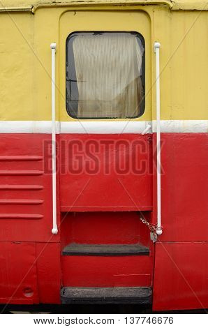 The train stops in depot.Its iron door is locked.