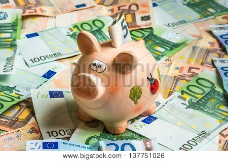 Piggy Bank In A Pile Of Euro Money