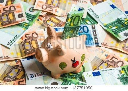Piggy Bank In A Pile Of Euro Money