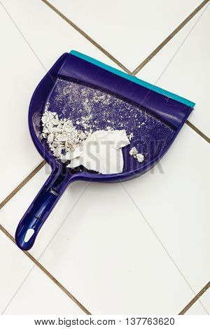 Scoop hygene chores housework tidying sweeping concept. Dust pan with garbage. Sweeping tool with dirt.