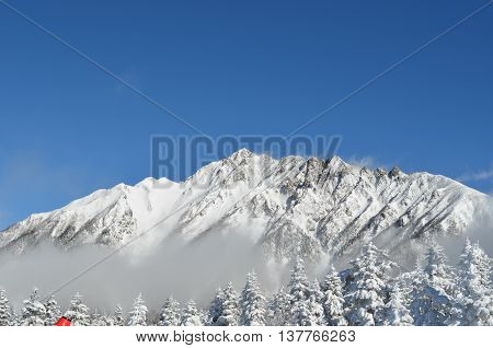 A mountain covered with white snow in Oku-Hida Japan.