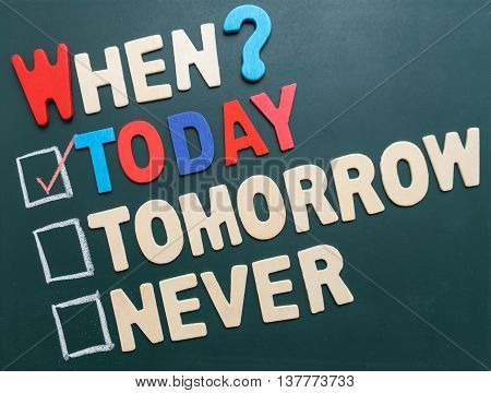 Business time management concept - When? Today Tomorrow or Never with checkboxes and red marking on blackboard