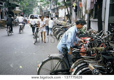 GUANGZHOU / CHINA - CIRCA 1987: A long row of parked bicycles--the primary mode of transportation for Chinese citizens during the 1980s.