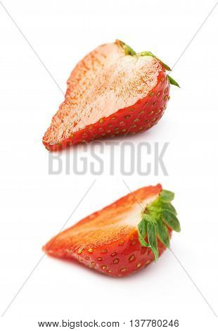 Slice cross-section of a single ripe red strawberry isolated over the white background, set of two different foreshortenings