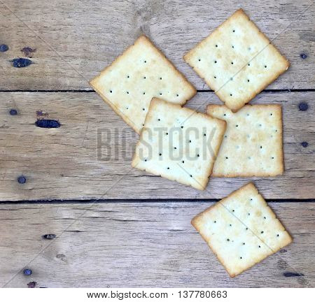 Crackers on wooden background for coffee in the morning.