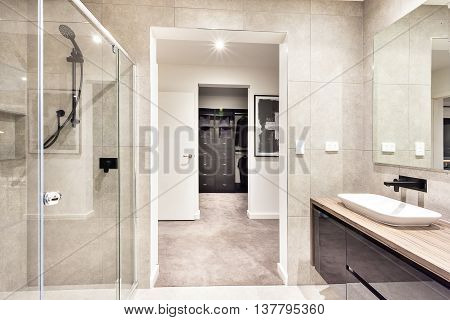 Entrance To A Laundry Room Through The Modern Washroom