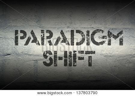 paradigm shift stencil print on the grunge white brick wall