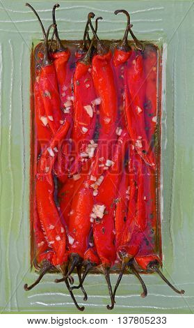 Sour salad of red peppers and garlic in marinade