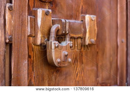 padlock wood weighs on a wooden door
