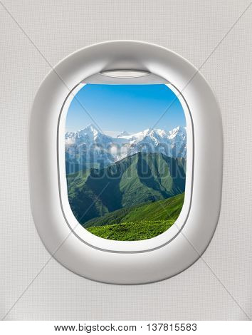 Looking Out The Window Of A Plane To The Mountains In Georgia