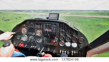 Light plane landing on the rough airstrip - view from the pilot's seat
