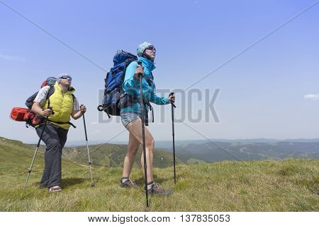 Hiking in the mountains in the summer on a sunny day.