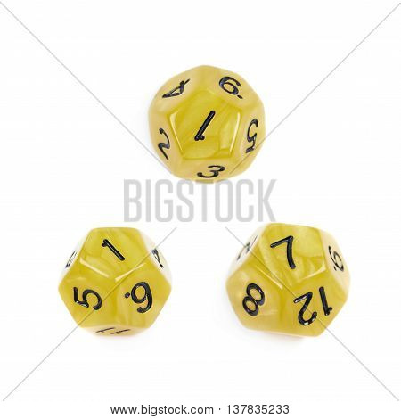 Yellow roleplaying polyhedral dodecahedron gaming plastic dice isolated over the white background, set of three different foreshortenings