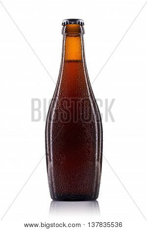 Bottle of dark beer with drops isolated on white background.