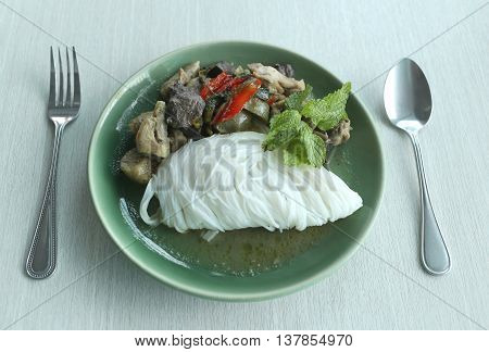 Curry chicken noodles (KHANOM CHIN) with vegetableThis is local Thai foods in Vermicelli rice.