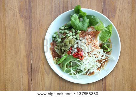 Local Thai foods of Rice Vermicelli is name KHANOM CHINspicy noodles with vegetable and hot soup.