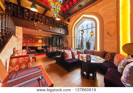 MOSCOW/RUSSIA - DECEMBER 2014. The restaurant's interior - CAMPUS in the east Arabian style. The main dining room with tables windows and oriental decor