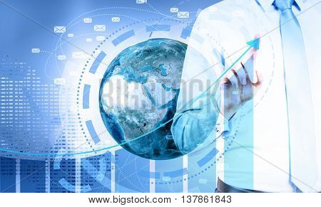 Global e-mail marketing concept. Businessman pointing at business chart top on digital background with globe and network.