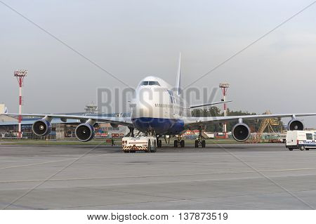 MOSCOW, RUSSIA - SEPTEMBER 26, 2014: Boeing 747 Transaero towed to the runway. Transaero Airlines has ceased to exist in 2015.