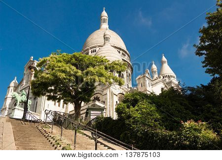 The Sacre Coeur basilica is a Roman Catholic church located at the summet of the butte Montmartre the highest point in Paris.
