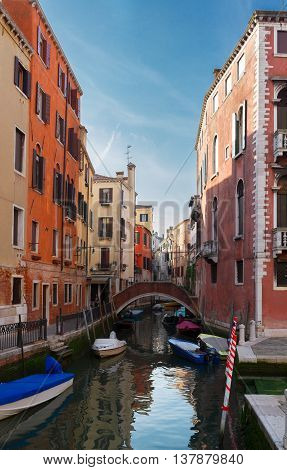 traitional Venice houses and bridge over water of small cosy canal in old town, Italy