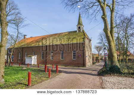 Old church in a street in Oudeschans Holland