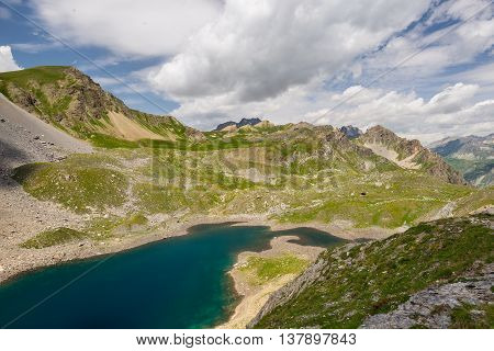 High Altitude Blue Lake In Idyllic Uncontaminated Environment Once Covered By Glaciers. Summer Adven