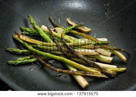 Grilled green asparagus with lime friend. Healthy food.