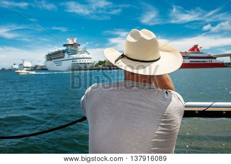 A senior man going back to cruise ship after island tour