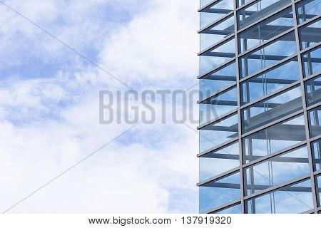 The cloud reflectthe cloud reflection with the glass building with the blue sky.The glass building reflection with the cloud and blue sky.