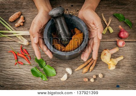 The Women Hold Mortar With Pestle And Spice Red Curry Paste Ingredient Of Thai Popular Food On Rusti