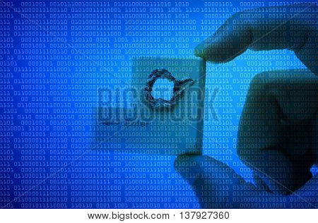 Hacker's hand picking up computer enter button with a hole representing computer security breach isolated