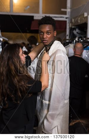 MILAN ITALY - JUNE 19: Beautiful model poses in the backstage just before Damir Doma SS 17 show during Milan Men's Fashion Week on JUNE 19 2016 in Milan.