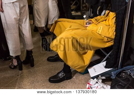 MILAN ITALY - JUNE 19: Detail of a model sitting in the backstage just before Damir Doma SS 17 show during Milan Men's Fashion Week on JUNE 19 2016 in Milan.
