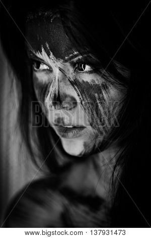 Spooky portrait of the woman. Demon theme on Halloween. Black-and-white Version of the Image