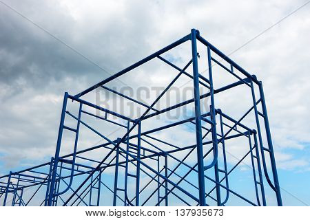 Scaffolding site erection on cloudy background, Steel frame.