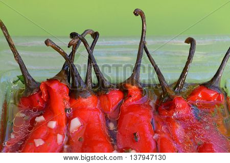 Sour salad of red peppers and garlic in marinade
