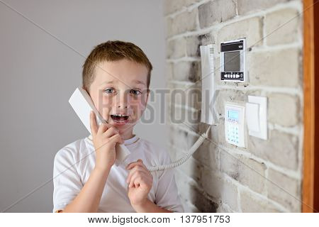 Little Baby Boy Talking On Intercom