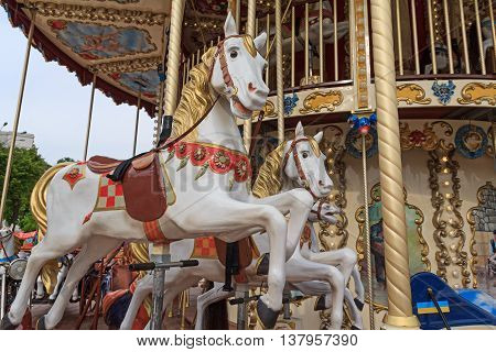 Beautiful horse on the carousel street. Carnival