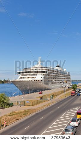 RIGA LATVIA - JUNE 7 2016: 12 decks MS The World (IMO 9219331) in the port of Riga Latvia. The World is the largest privately owned residential yacht (165 apartments gross tonnage 43524 tons)