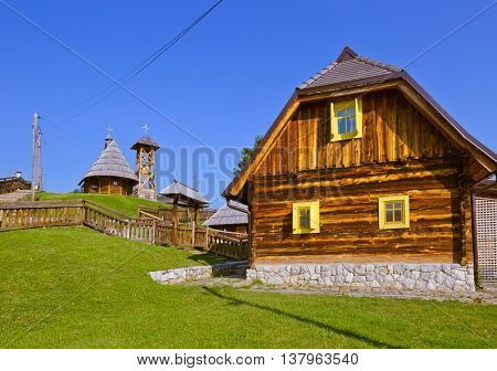 Traditional village Drvengrad Mecavnik in Serbia - architecture travel background