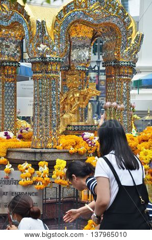BANGKOK THAILAND-20 JUNE 2016: Erawan Shrine Hindu shrine cityscape view of Ratchaprasong area in Bangkok. It is the main shopping and business street.