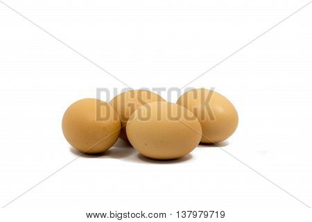 Close up four eggs isolated on white background